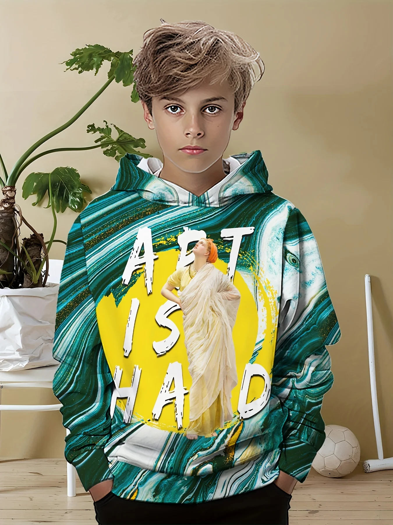 Smiling bpy wearing a colorful 3D hoodie with long sleeves, standing outdoors with playful energy green