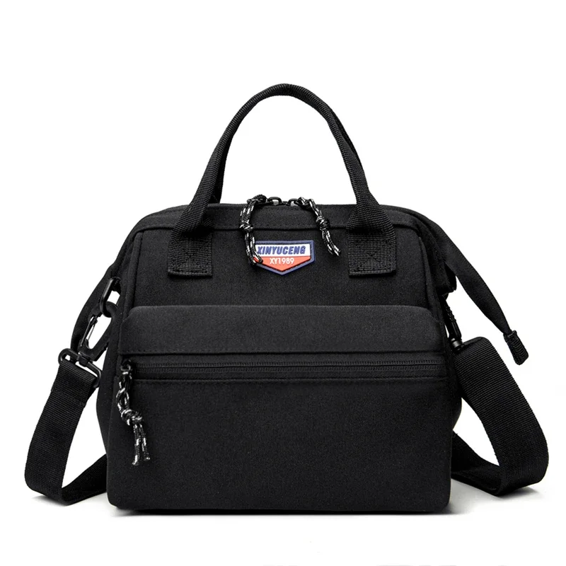thumbnail image 1 of Bolso de mano para madre y bebé de lona de gran capacidad de color sólido de venta caliente 2024 nuevo bolso cruzado con cremallera para mujer, 1 of 5