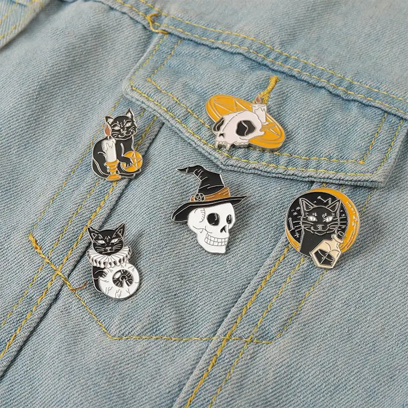 

Cat Duke Enamel Pins Custom Witch Skull Skeleton Eye Candle Brooches Lapel Badges Dark Punk Gothic Jewelry Gift for Friends