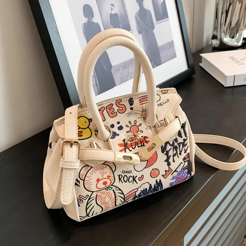 

Women Graffiti Handheld For 2024 New Trendy And Fashionable Unique Texture Versatile Crossbody Bag Commuter Bag