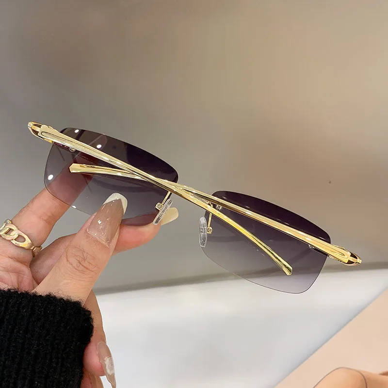 Stylish rimless rectangle sunglasses with tinted lenses and gold temples