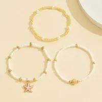 Chaîne de cheville en perles de Millet, Style bohème, coquille d'étoile de mer, ensemble de trois couches, accessoire de bijoux de pied élégant et de plage, été 2