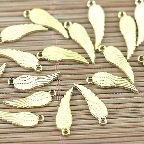 

100pcs gold tone 17x5mm 2sided wing design charms H1653