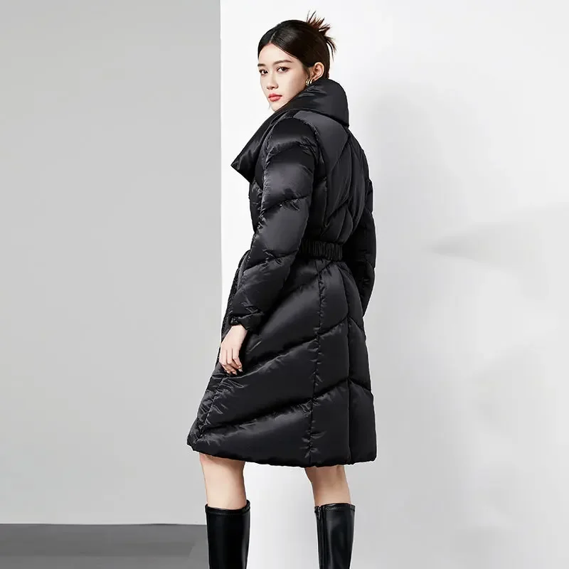 Down jacket long solid color loose waist thick warm lapels high-end fashion glossy white duck down ladies coat.