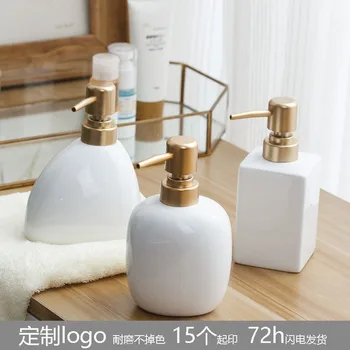 white ceramic soap dispenser