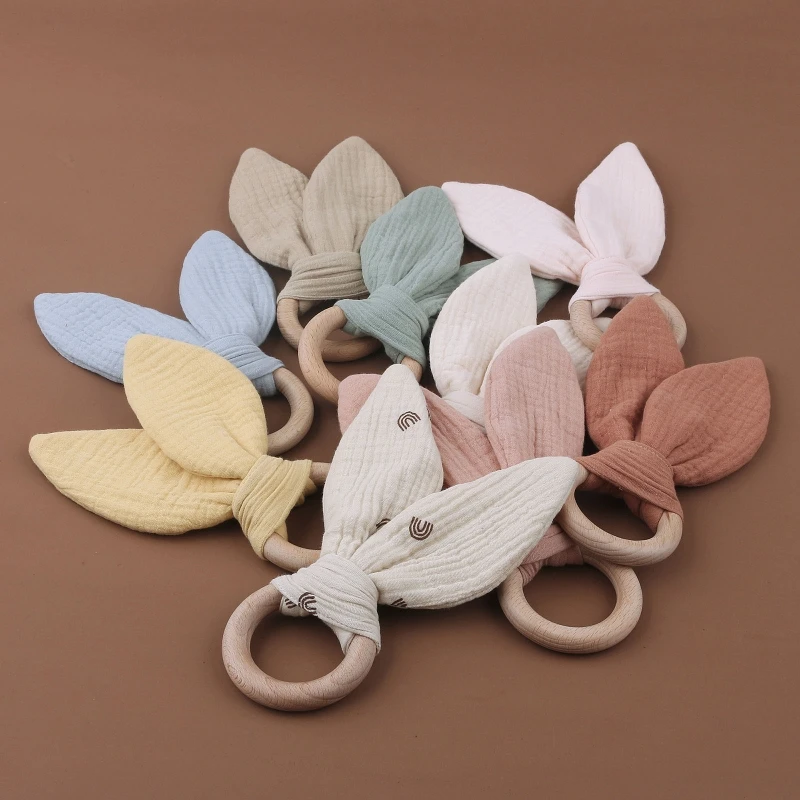 

Wooden Baby Teether Cotton Cloth Teething Ring Rattle Toy