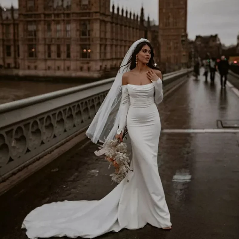 off shoulder long sleeve mermaid wedding dress Off-the-shoulder mermaid wedding dress with long sleeves