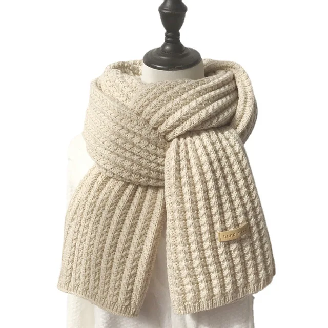 Stay warm and stylish this winter with the Womens Winter Millet Grain Solid Color Wool Warm Student Knitted Scarf