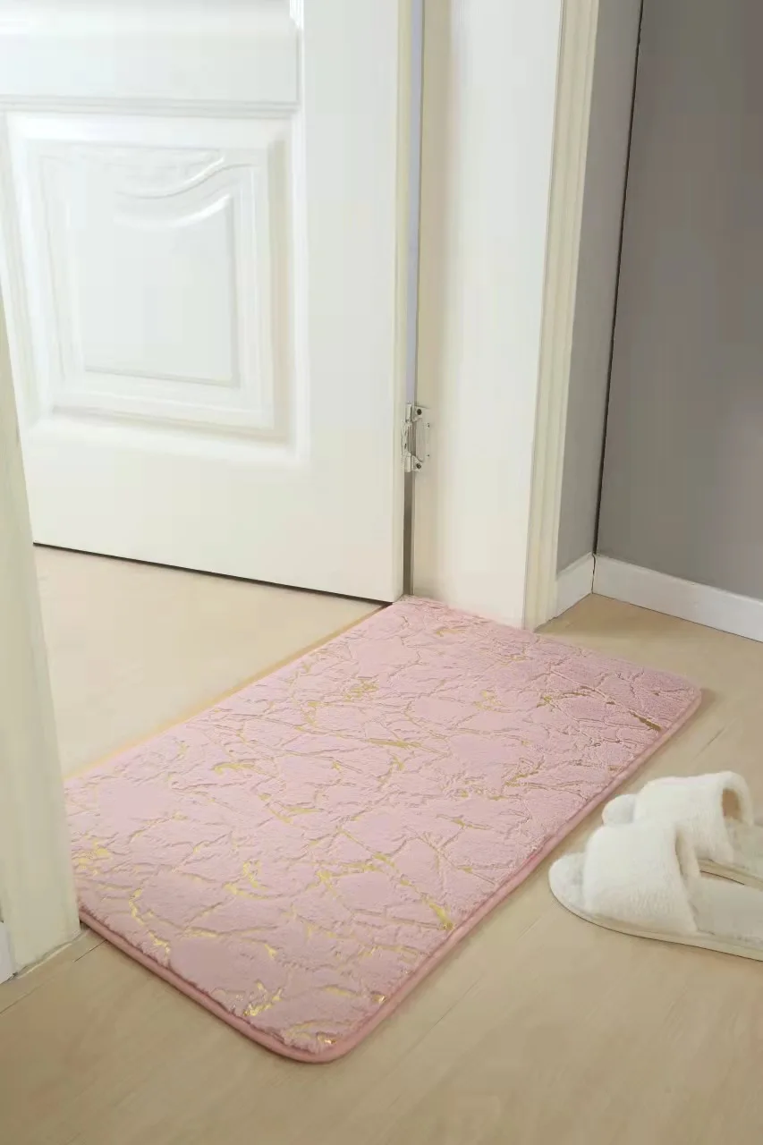 Soft faux rabbit bath mat in beige, rectangular, non-slip, for bathroom or living room.
