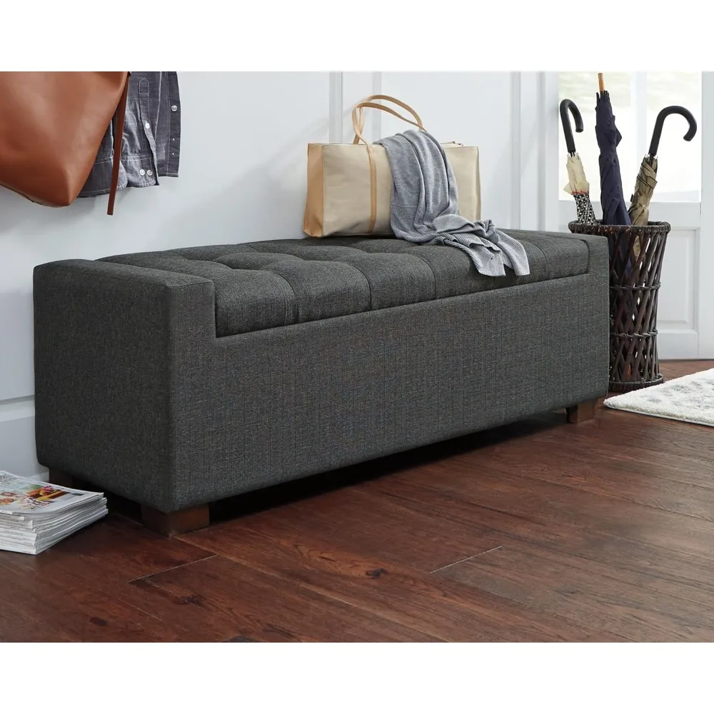 

Trendy trunk ottoman is crafted with a polyester gray upholstery, a tufted seat cushion with a hinged lid for access to storage