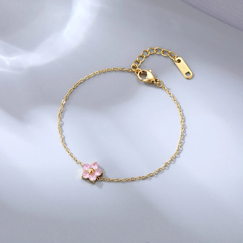 Damesarmband van roestvrij staal, roséverguld met 7 zirkoniastenen
