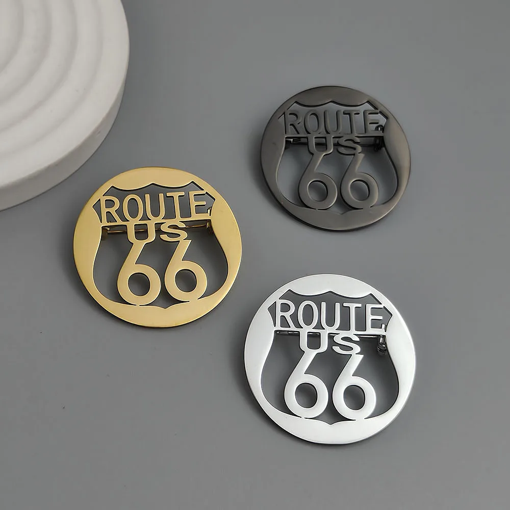 Route 66 hollow-cut stainless steel lapel pin in Gold, Black, and Silver finishes showing US shield cutout design