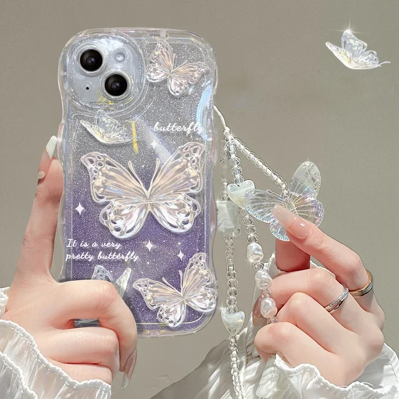 thumbnail image 1 of Funda con cordón degradado de mariposa brillante para iPhone, 14, 13, 15, 16 Pro Max, 12, 11, X, Xr, Xs, 8, 7 Plus, cadena de muñeca de mano, cubierta de onda suave, 1 of 5