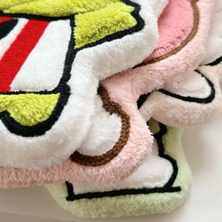 Hello Kitty My Melody Pochacco towel laid flat