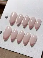 10 pairs of handmade almond-shaped nails in a soft pink color with cat-eye design, featuring a French minimalist and fashionable