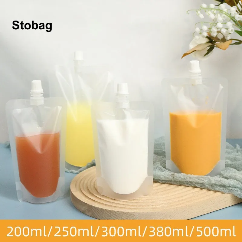 

StoBag 100pcs Wholesale Frosted Transparent Liquid Packaging Nozzle Drinking Bags Juice Beverage Sealed Storage Reusable Pouches