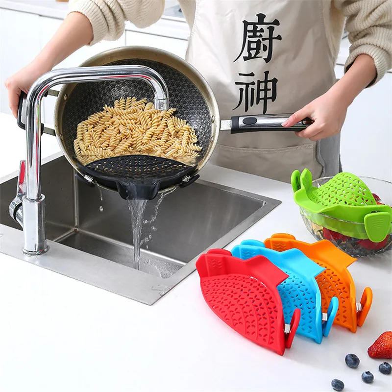 https://ae01.alicdn.com/kf/S606d1a32f9c84ae580be2074fce9d0d6G/Silicone-water-drainer-pot-side-block-household-noodles-vegetables-and-fruits-pouring-filter-anti-sprinkler-leakage.jpg