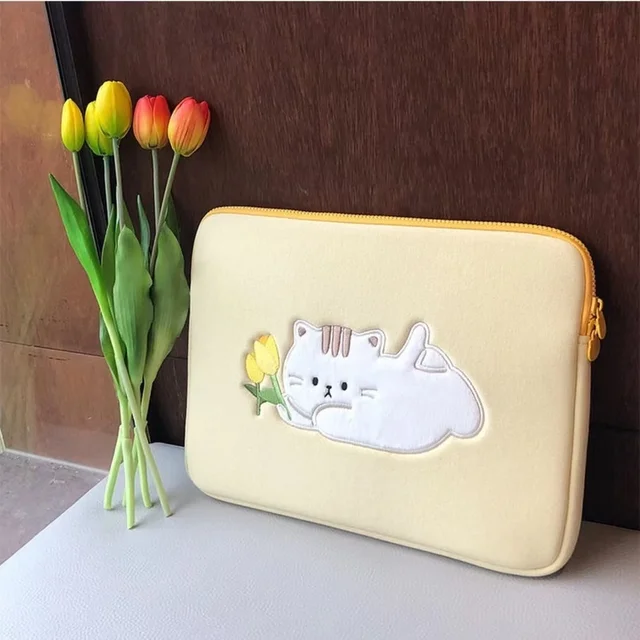 Stylish and functional laptop bag with a cute cartoon design, perfect for women and suitable for laptops and tablets such as the iPad Pro and Macbook.