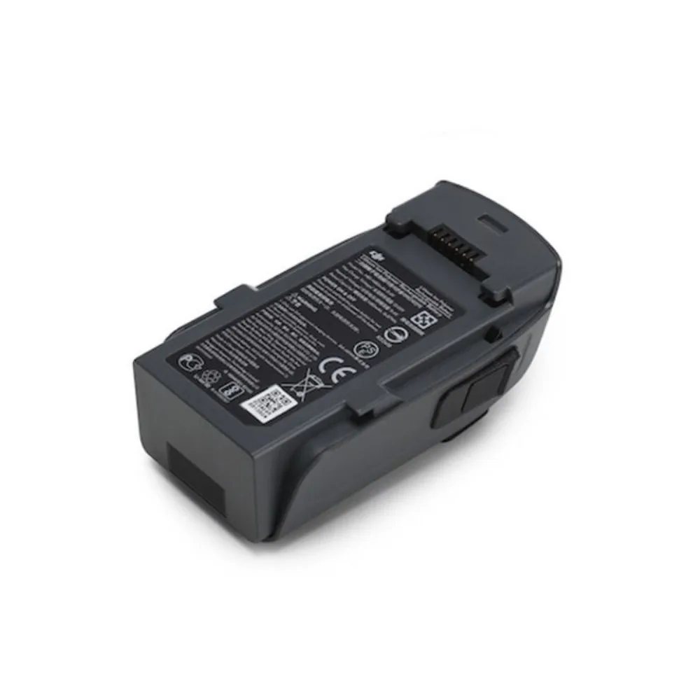 Batterie de vol intelligente pour DJI Spark insérée dans le compartiment du drone, prête à l'emploi