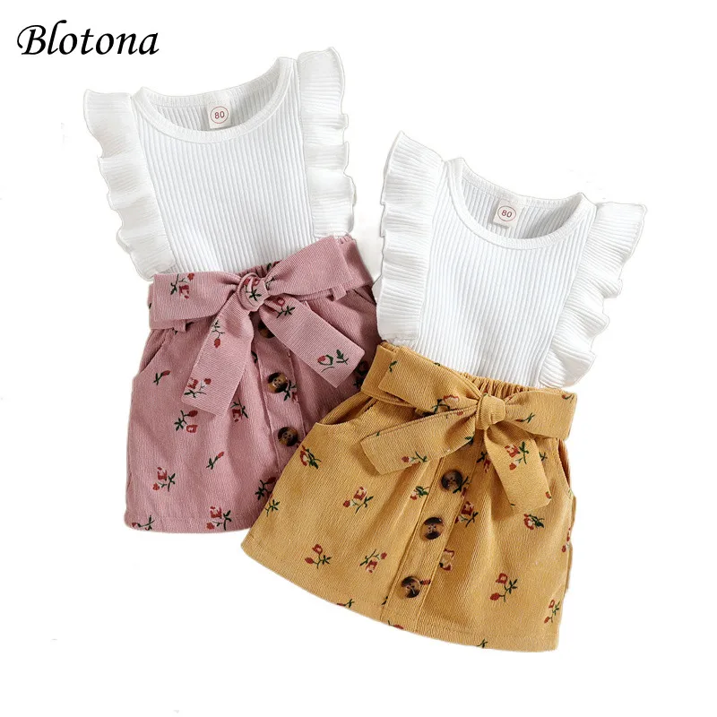 

Blotona Baby Girl Summer 2Pcs Set, O-Neck Ruffled Fly Sleeve Solid Color Ribbed Tops Floral Skirt with Waist Belt 9M-4Y