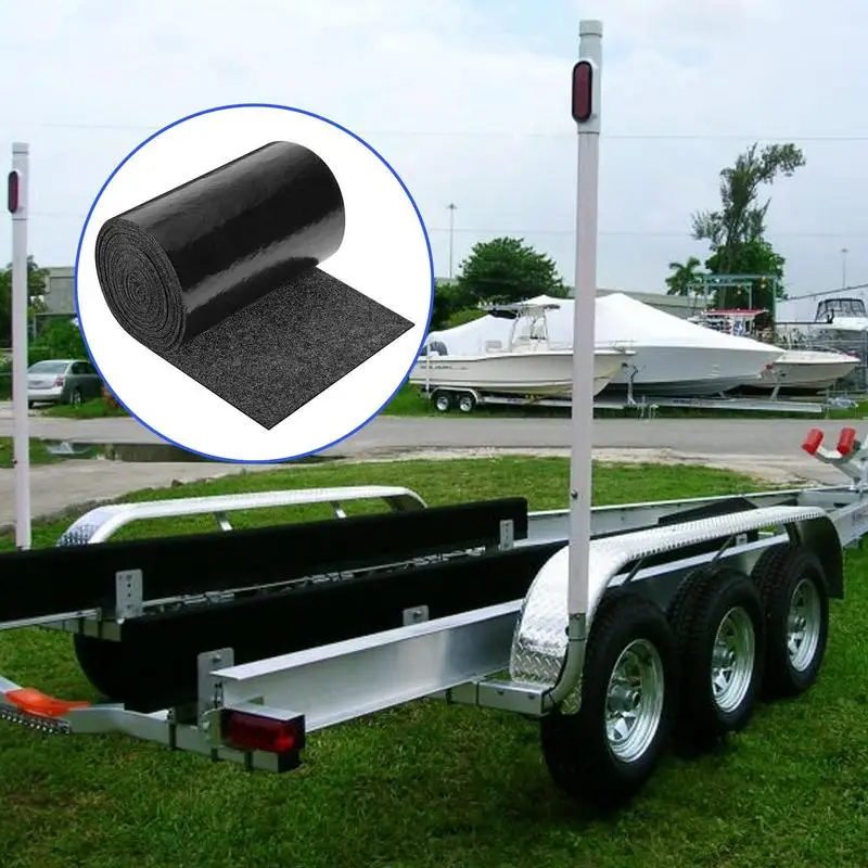 Owner cleaning carpet for bunks on boat trailers