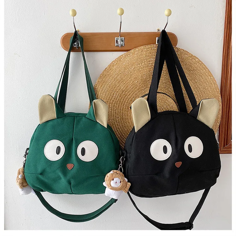 green and black cat canvas tote bag from meowgicians