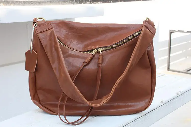 thumbnail image 1 of Bolso de hombro de piel de vaca de gran capacidad con forma de concha, estilo europeo y americano, informal, sencillo y versátil, para desplazamientos diarios, 1 of 5