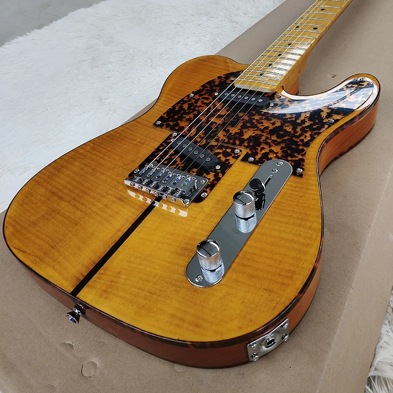 

This is a classic sunset color 6-string electric guitar with tiger skin guard, with unique and beautiful sound