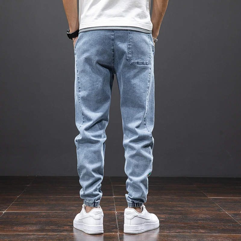 Large size elastic workwear men's ankle tied Harlan denim pants denim trousers cargo jeans wear-resistant and fat added plus size trendy and loose
