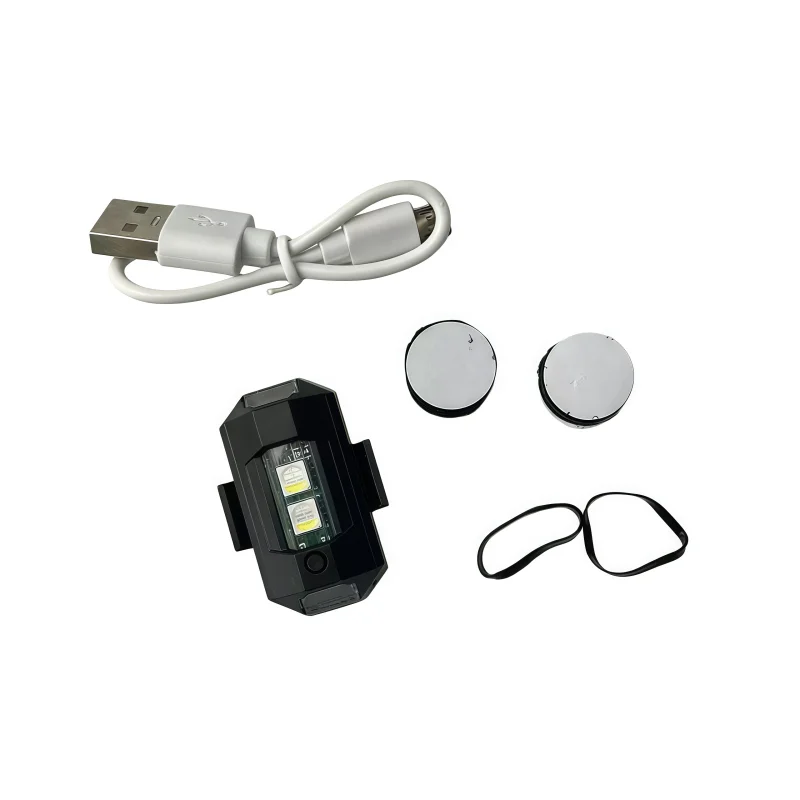 Feu clignotant LED 7 couleurs rechargeable USB posé sur une table, montrant ses 7 couleurs vives et son port de charge USB.
