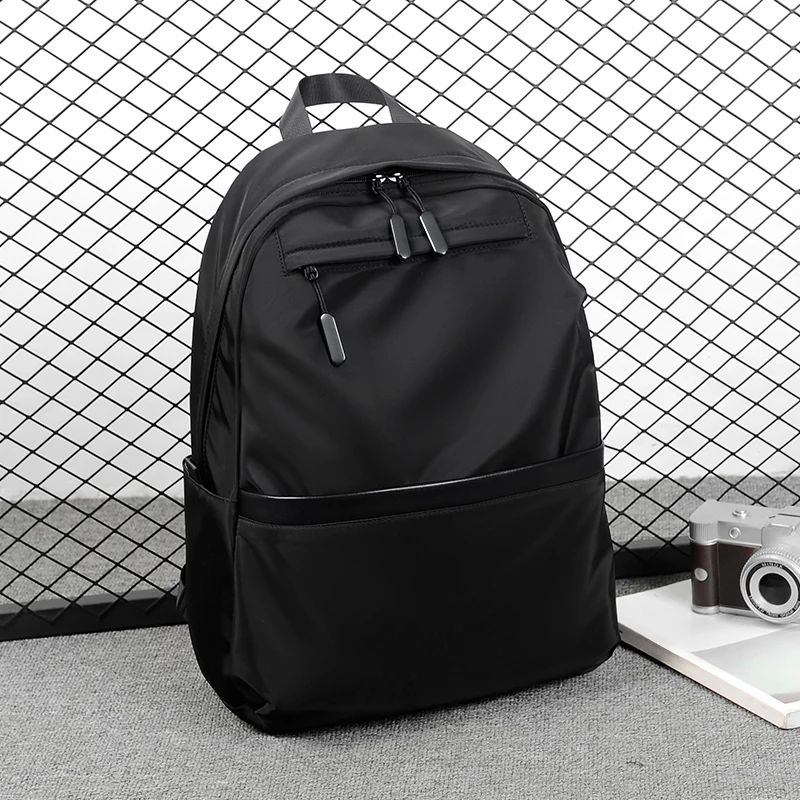 Neutral backpack with laptop compartment, adjustable shoulder strap, commuting bag, smooth texture, travel backpack