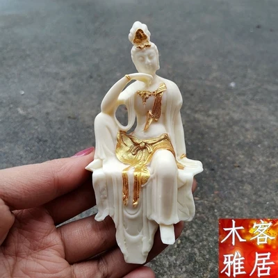 

Exquisite ivory fruit half seated small Guanyin Buddha statue ornament