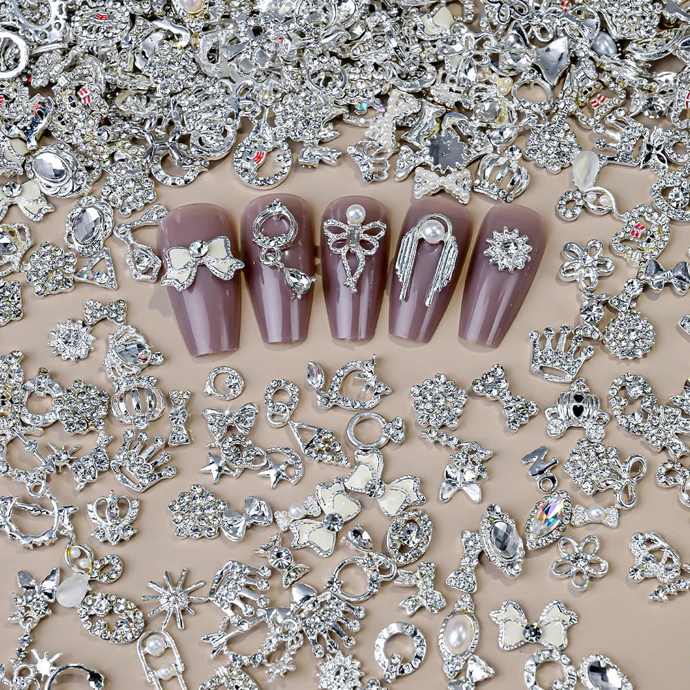 50pcs 혼합 스타일 실버 네일 장식품 3D Aolly 하트/나비/꽃/스타 네일 라인 석 매력 블링 무작위 DIY 네일 장식