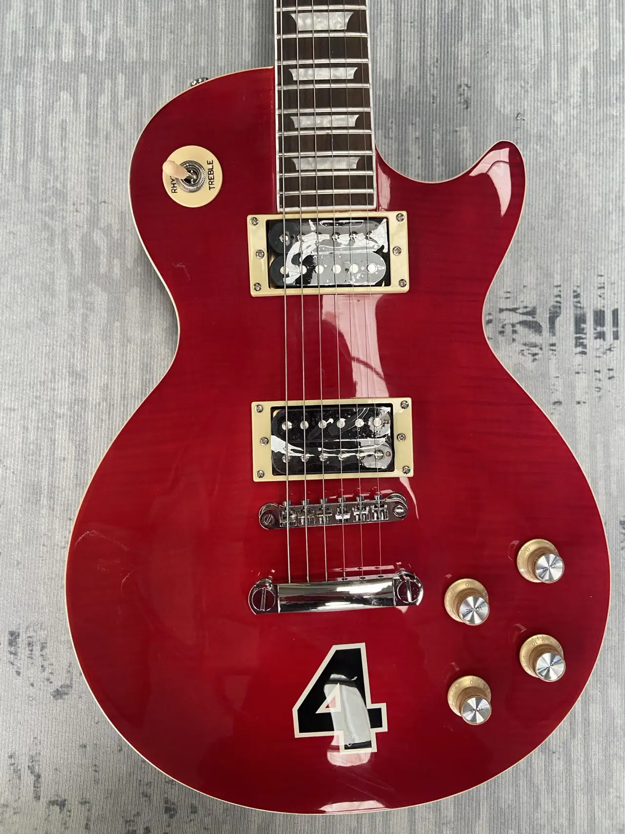 

Gib$on guitar logo, Made in China, red, body has 4, customizable, high quality mahogany body, rosewood fingerboard