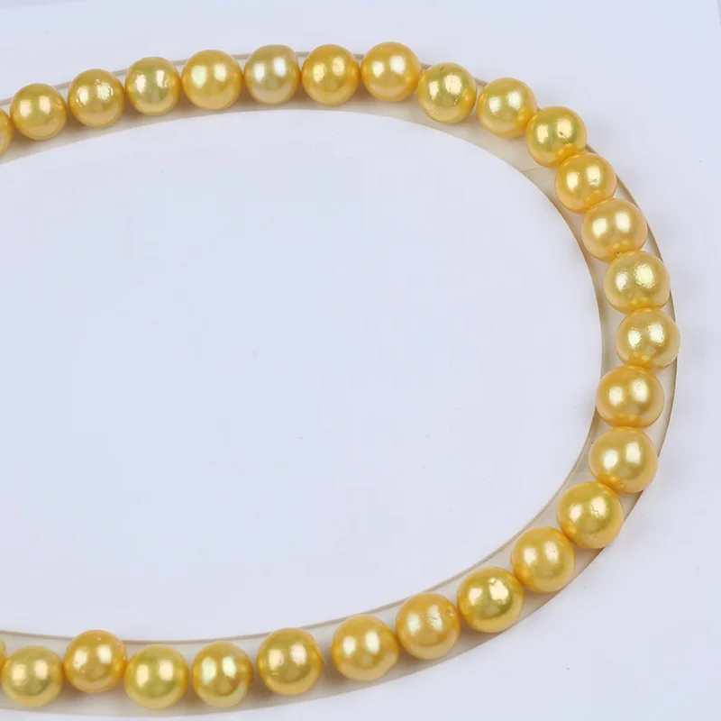 

Wholesale 9-12mm freshwater pearl dyed gold color edison round loose pearls strand for jewelry making