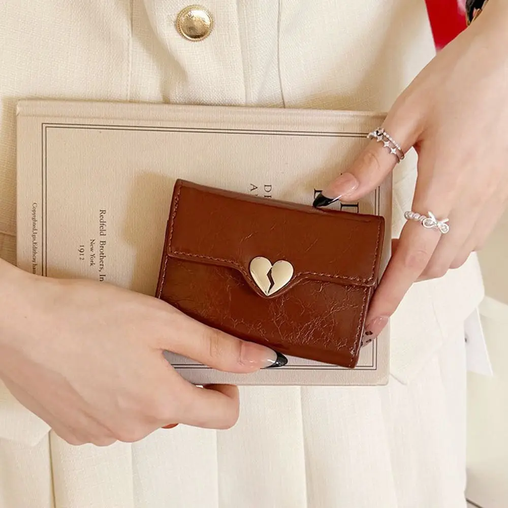 Portafoglio portatile coreano a forma di cuore con crepa Portafoglio in pelle da donna di alta qualità in pelle PU Piega borsa da studente corta da donna - immagine 4