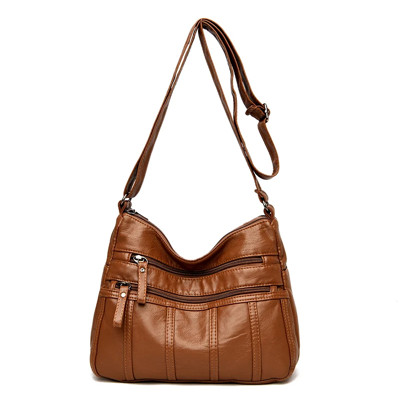 Sleek Black Crossbody Travel Bag with Adjustable Straps and Zipper Compartment