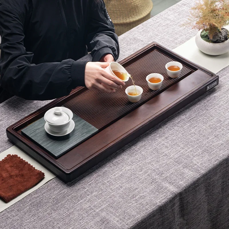 

Nine tea tray heavy bamboo tea tray drainage tea table black gold stone tea sea household tray nanzhu whole kung fu tea set