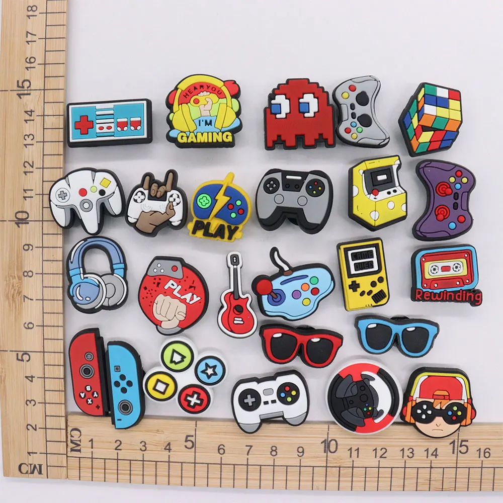 

Mix 50PCS PVC Croc Jibz Rewinding Play Game Glasses Gamepad Rubik's Cube Garden Shoes Button Decorations Slipper Accessories