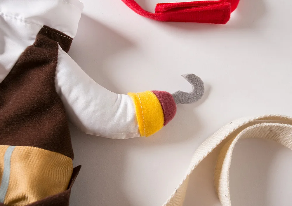 Close-up of a plush toy arm with gray felt hook wearing KittyNook Cat Co.'s Funny Pirate Cat Halloween Costume.