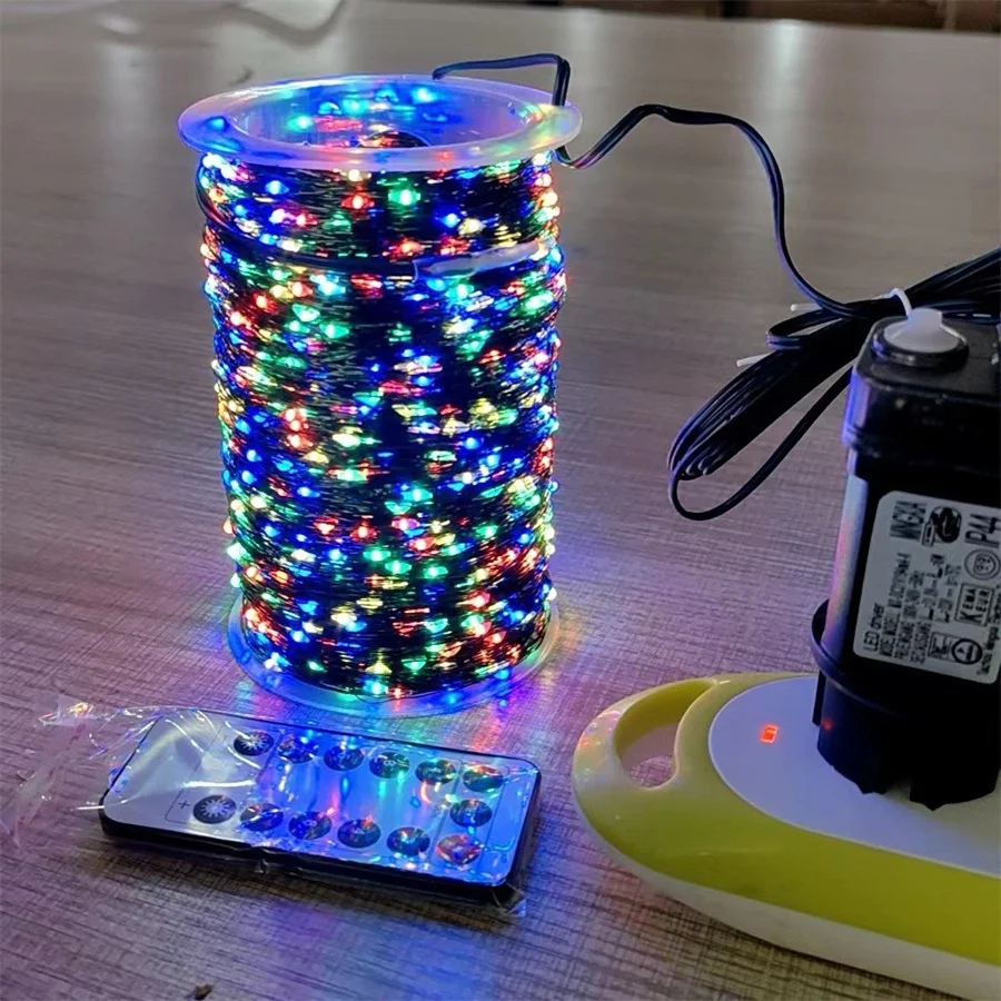 thumbnail image 1 of Guirnalda de luces navideñas con cable de cobre verde de 100 m y 200 m para exteriores, 24 V CC, con enchufe, para árbol de Navidad, 1 of 5
