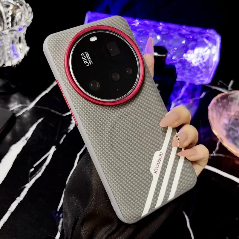 Luxury Leather Wrapped Phone Case with Magnetic Suction and Red Lens Accent