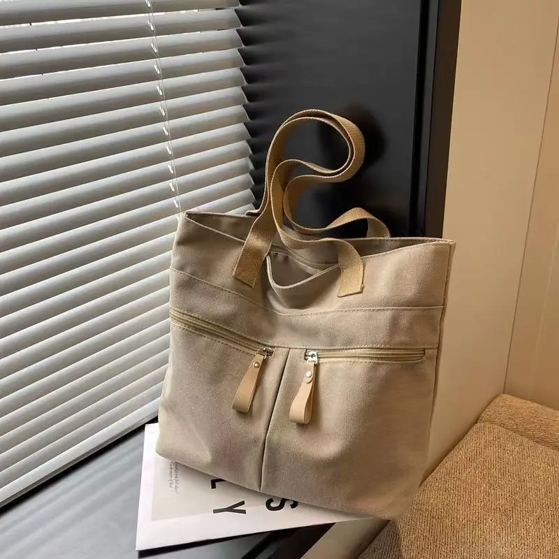 

2024 New Korean Canvas Bag Women's Solid Color Versatile Large Capacity One Shoulder Handbag Personalized Commuter Tote Bag