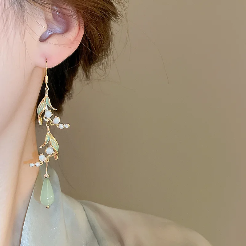 S6423d62d6c5b499c986d3f5aa1b7d6ffu Elegant White Orchid Flower Earring for Women Ladies Temperament Metal Leaves Long Tassel Drop Earrings Hook Jewelry Accessories Mallzona