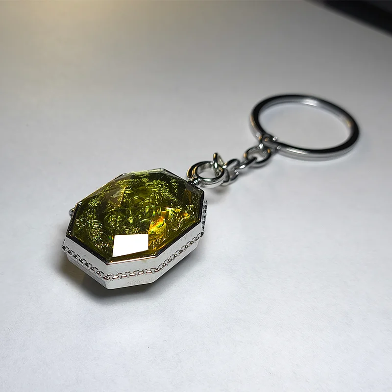 Sparkle Gem Keychain: Multi-Faceted Green/Yellow Crystal with Metal Rim and Unique Anti-Loss Design