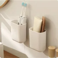 Bathroom waterproof wall-mounted toothbrush holder without punch Comb makeup brush plastic case household items 1