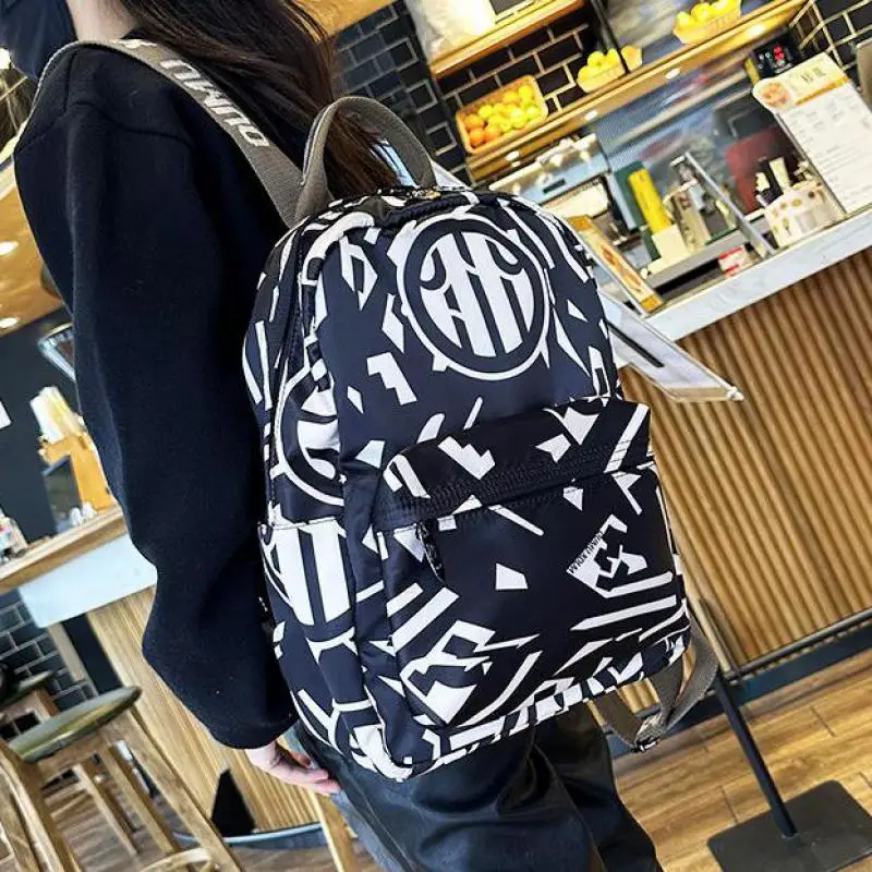 

New Fashion Oxford Fabric Letter Printing Backpack For Women High Capacity Waterproof Casual Versatile Canvas Travel Bag Tide
