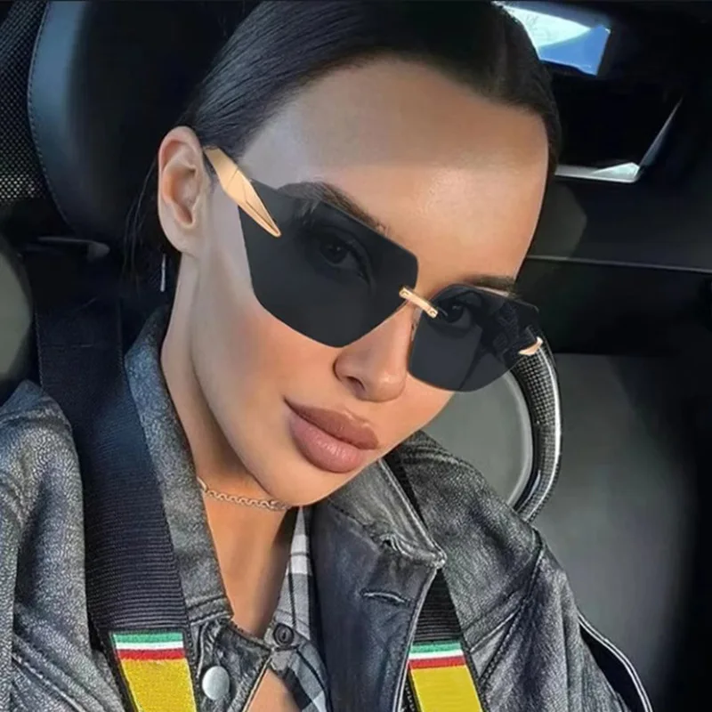 New Frameless Edge-cut One-piece Curved Sunglasses For Women, High-end Trendy Metal Car Sunglasses 81069