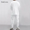 Mens Casual Knitting Two Piece Sets 2023 New Winter Fashion Irregular Top Sweater and Solid White Sweatpants Male Tracksuits Set 2