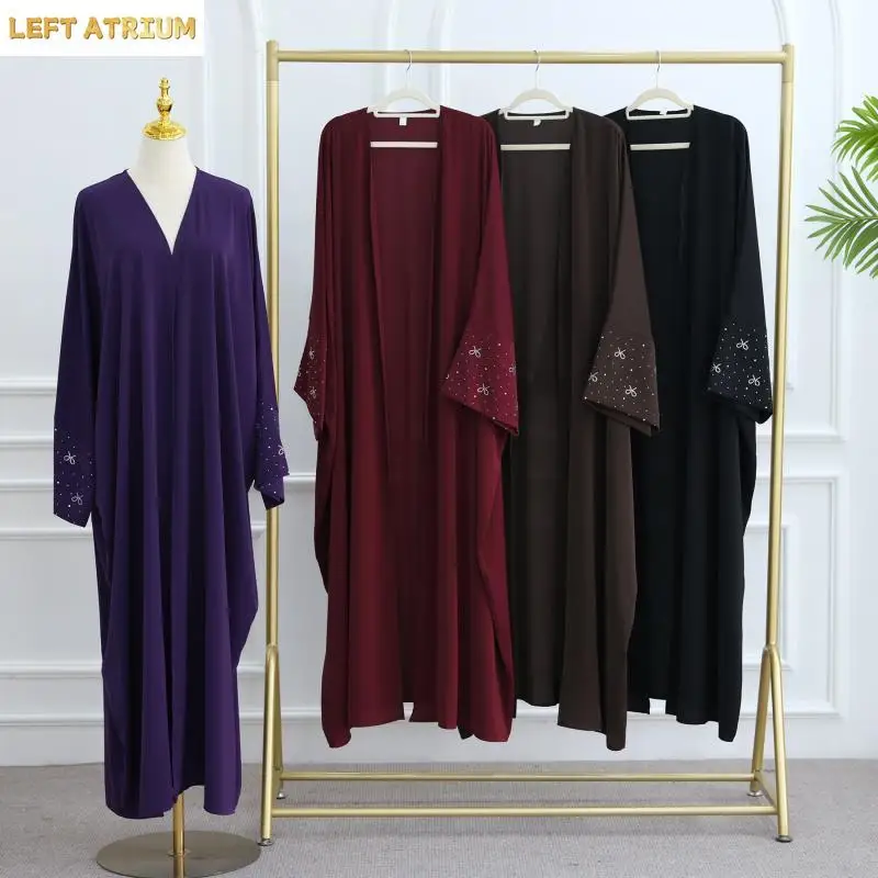 Dubai luxurious new cloak for Muslim women, decorated with beads and bow, in a solid color, elegant Arabic cardigan for Ramadan and Eid